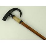 A mid 20th century Alpine walking stick with goat hoof collar and horn handle,