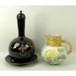A Jackfield ceramic lidded bottle vase and plate, in black ground with enamel and gilt decoration,