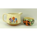 A Clarice Cliff Bizarre crocus Newport Pottery jug, and a Pumpkin Bizarre sugar bowl,