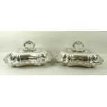 A pair of Walker and Hall silver plated tureens, with detachable handles, 34 by 26 by 16cm.