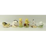 A collection of Royal Doulton Winnie the Pooh figurines, comprising Pooh Counting the Honeypots,