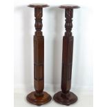 A pair of mahogany jardiniere stands, of square section form to the lower stems and balusters above,