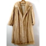 A vintage 1960's three quarter length mink coat, of blonde colour, aproximately size 14.