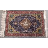 A Turkish Hereke finely knotted wool rug, with medallions, pendants,