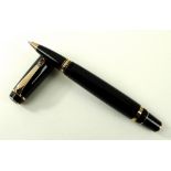 A Montblanc Boheme Rose Gold Marron rollerball pen, black resin with rose gold coloured fittings,