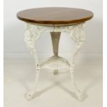 A Victorian cast iron 'Brittania' table, with white painted legs and modern circular top,