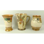 A group of three Crown Ducal ceramics, by Charlotte Rhead, comprising a jug in the patchwork design,