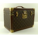 A Louis Vuitton toiletry case (M21826), in monogram coated fabric and cowhide leather trim,