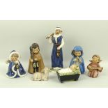 A Hummel Nativity set of seven pieces comprising Joseph, 17cm, Mary, 10cm, baby Jesus in crib,