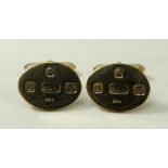 A pair of 9ct gold cufflinks, of oval form, decorated with prominent hallmarks, London 1978,