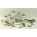 A group of four silver and cut glass dressing table items,