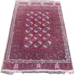 An Afghan Ankhoi hand knotted wool rug, red ground, 236 by 155cm.