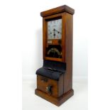 An early 20th century oak cased 'Clocking In' machine, National Time Recorder Co. Ltd., the 9.