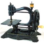 TIME UTILIZER SEWING MACHINE. 12ins tall, ornate cast iron base, black with traces of gold, hand