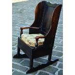 LAMBING CHAIR. 38.5ins tall at rear, oak lambing chair on rockers, 26ins long. Settle style with