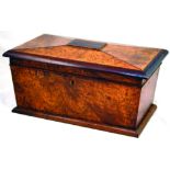 TEA CADDY. 19th century maple (?) wooden tea caddy, sarcophagus shape. 6.6ins tall, 13.5ins long.