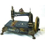 THE CONQUEST SEWING MACHINE. 10.5ins tall, heavy cast iron base with lion paw feet, hand cranked