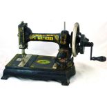 PEERLESS SEWING MACHINE. 10.5ins tall, cast iron base, black with gold decoration PEERLESS in gold