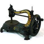 SEWING MACHINE. 10.5ins tall, cast iron base, black with gold decoration, hand cranked. NR