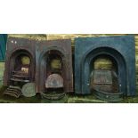 THREE CAST IRON FIREPLACES.