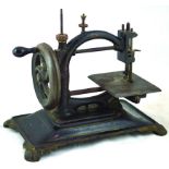 SEWING MACHINE. 11ins tall, cast iron base, black with gold decoration, hand cranked. NR