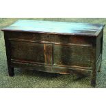 EARLY OAK BLANKET CHEST. 23.5 by 43 by 19ins. Heavy hinged plank top panelled base. (Buyer