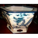 A 20th century Oriental blue and white octagonal jardiniere.