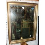 A 20th century gilt framed rectangular wall mirror, with bevelled plate.