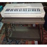 A Hohner electric organ, cased.