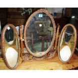 A gilt framed triptych dressing table mirror.