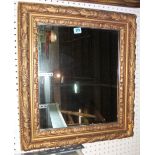 A rectangular gilt framed wall mirror.