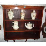 An Edwardian mahogany hanging bookcase.