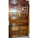 A 20th century Ercol style bookcase with glazed top section.