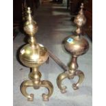 A pair of 19th century brass firedogs.