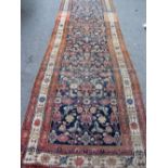 A Fereghan runner, Persian, 344cm x 110cm.