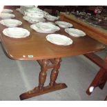 A 20th century Ercol extending dining table.