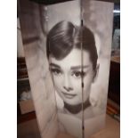 A 20th century three fold screen printed with Audrey Hepburn in Breakfast At Tiffany's.