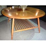 A 20th century elm Ercol oval coffee table,