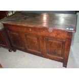 An 18th century oak coffer with panel decoration.