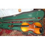 A 20th century cased violin.