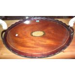 A 20th century oval galleried mahogany and inlaid tray.