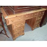 A 20th century pine pedestal desk.