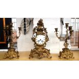 A gilt brass clock garniture, early 20th century, of 18th century French design,