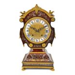 A Louis XIV style ormolu mounted 'tete-de-poupee' mantel clock, 19th century,