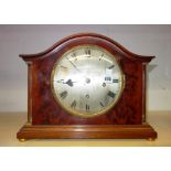 A mahogany cased mantel clock, circa 1900, the domed case over a silvered 7.