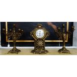 A gilt brass mantel clock garniture, circa 1900,
