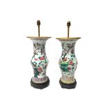 A near pair of Chinese famille-rose porcelain vases, circa 1900, of slender baluster form,