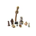 A group of antiquities, comprising; a terracotta candlestick, 12cm high,