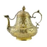 A mid 18th century Dutch silver gilt teapot of pear shaped form,