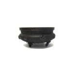 A Chinese bronze censer, probably 19th century, of compressed circular form, with leiwen ground,